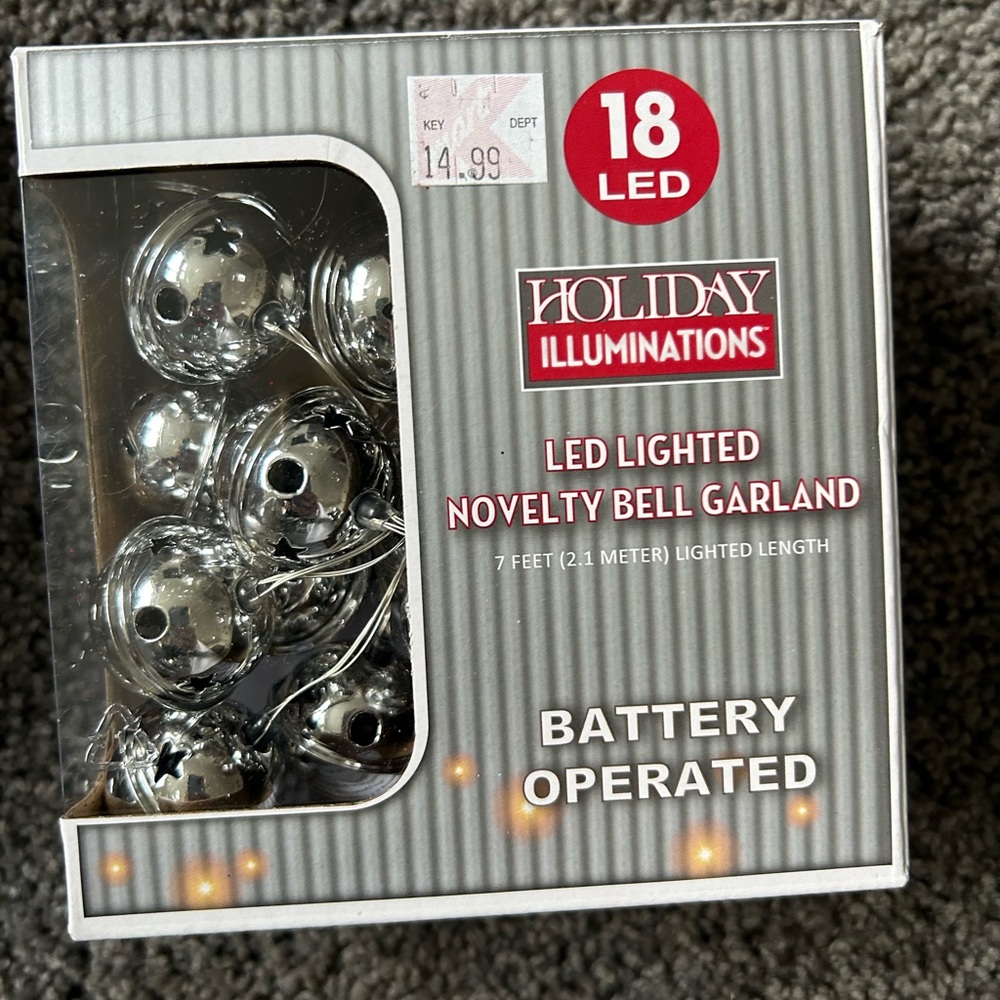Holiday novelty silver bell garland that illuminates